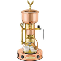 A copper and brass Elektra Micro Casa Semiautomatica Espresso Machine with a visible steam wand, pressure gauge, and a set of two espresso cups on the base.