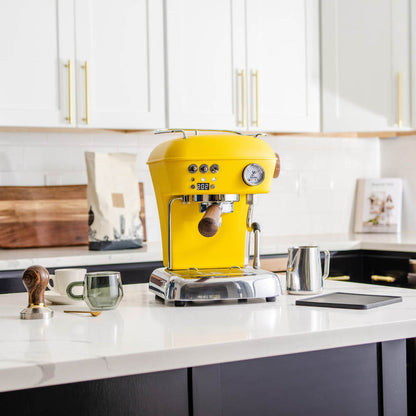Ascaso Dream PID Sun Yellow Espresso Machine in a kitchen setup